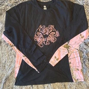 Black and pink Realtree long sleeves, 3X. Worn often but no damage